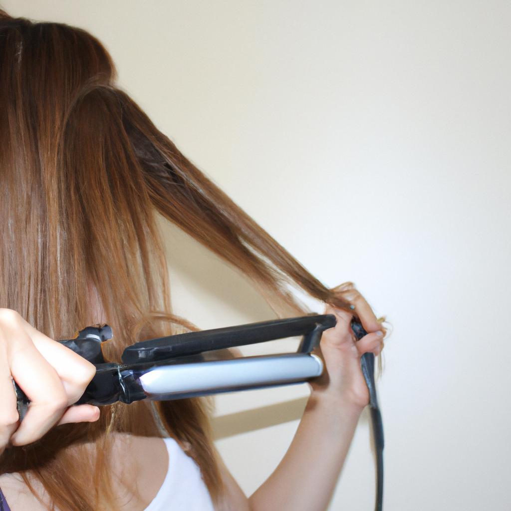 Woman curling hair with iron